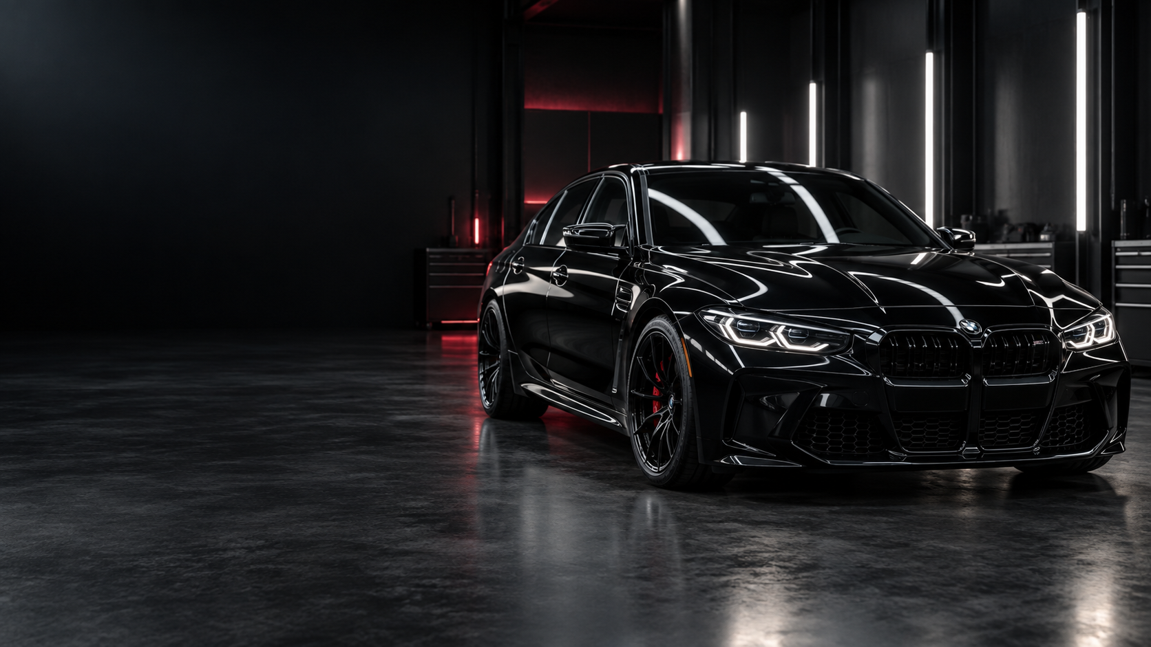 Glossy black sedan inside a premium detailing studio